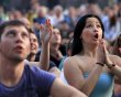 Soccer fans react as they watch Euro 2012 soccer match between Spain and Italy in the fan zone in Kiev