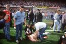 In a file picture taken on April 15, 1989 police and medics try to help football fans at Hillsborough stadium where 96 fans were killed and hundreds injured after support railings collapsed during a match between Liverpool and Nottingham Forest