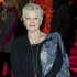 FILE - A Tuesday, Feb. 7, 2012 photo from files showing British actress, Judi Dench, arriving for 'The Best Exotic Marigold Hotel' world premiere at a central London venue. Actress Judi Dench says she's battling to save her sight. The James Bond star told the Daily Mirror newspaper that she had been diagnosed with a degenerative eye condition that can cause blindness. In an interview published Saturday Feb. 18, 2012, she said that her sight was already so bad she couldn't read her scripts and even had difficultly distinguishing the people she was dining with. (AP Photo/Jonathan Short, File)