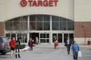 Shoppers leave a Target store in North Olmsted, Ohio Thursday, Dec. 19, 2013. Target says that about 40 million credit and debit card accounts may have been affected by a data breach that occurred just as the holiday shopping season shifted into high gear. (AP Photo/Mark Duncan)