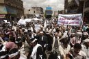 Yemeni members of the Peaceful Revolution Salvation Front chant slogans during a demonstration demanding independence of the judicial system from government control, in Sanaa, Yemen, Monday, April 23, 2012. Arabic on the banner reads, 