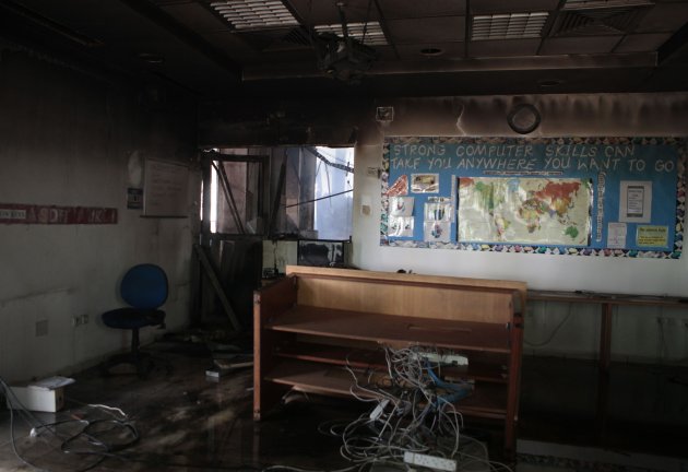 A view shows a classroom inside the American School after it was attacked by protesters in Tunis September 15, 2012. The death toll from Friday's attack on the U.S. embassy in Tunis, provoked by a film that mocks the Prophet Mohammed, rose to four, with 46 people injured, a hospital official said. Police fought hundreds of protesters who smashed windows, hurled petrol bombs and stones at police from inside, and started fires in the embassy. A Reuters reporter saw police open fire on protesters forcing their way into the embassy building. REUTERS/Zoubeir Souissi (TUNISIA - Tags: POLITICS CIVIL UNREST RELIGION)