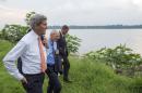 US Secretary of State John Kerry (L) walks with James Swan (2nd-L), US ambassador to the Democratic Republic of Congo, along the Congo River near the US Chief of Mission Residence in Kinshasa on May 3, 2014