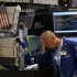 Trader Mario Picone works on the floor of the New York Stock Exchange