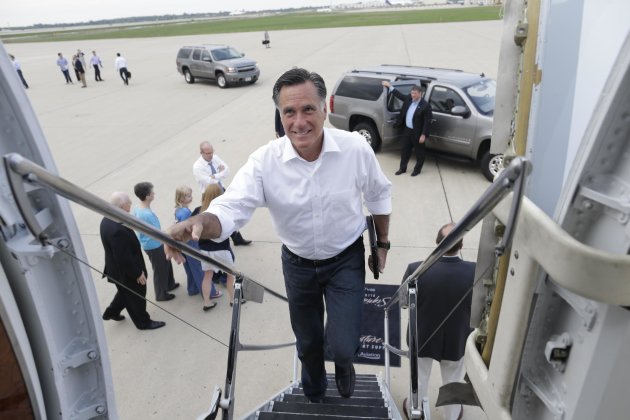 Republican presidential candidate and former Massachusetts Gov. Mitt Romney boards his campaign charter plane in Kansas City, Mo., after a refueling as he travels to Los Angeles, Sunday, Sept. 16, 2012. (AP Photo/Charles Dharapak)