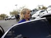Arizona Governor Jan Brewer enters her vehicle after talks with reporters and voting for Republican presidential candidate and former Massachusetts Governor Mitt Romney in