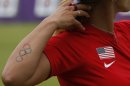 An Olympic rings tattoo of Khatuna Lorig of the U.S. is seen during the women's archery individual ranking round of the London 2012 Olympics Games at the Lords Cricket Ground in London