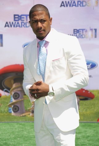 FILE - In a Sunday, June 26, 2011 file photo, Nick Cannon arrives at the BET Awards, in Los Angeles. Cannon said in a statement on the 92.3 NOW website that Friday, Feb. 17, 2012 was his last day hosting his New York City radio show, called "Rollin.". He said doctors had ordered him to cut back on his professional commitments and get more rest. The 31-year-old entertainer was hospitalized last month after suffering from a form of mild kidney failure. (AP Photo/Chris Pizzello, File)