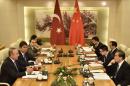 Turkish Foreign Minister Mevlut Cavusoglu(L) holds a talk with Chinese Foreign Minister Wang Yi(R) at the Ministry of Foreign Affairs in Beijing