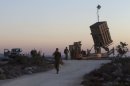 Israeli soldiers stand near an "Iron Dome" battery, near Jerusalem on September 8, 2013