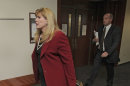 Assistant District Attorney Karen Pearson leads the prosecution team into court for a motions hearing for suspected theater shooter James Holmes in district court in Centennial, Colo., on Thursday, Aug. 30, 2012. Holmes has been charged in the shooting at the Aurora theater on July 20 that killed twelve people and injured more than 50. (AP Photo/Barry Gutierrez)
