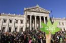 People participate in the so-called "Last demonstration with illegal marijuana" in front of the Congress building in Montevideo