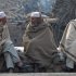 Afghan refugees who fled their country due to war and famine, sit at a roadside during the winter in Islamabad, Pakistan on Tuesday, Jan 31, 2012. (AP Photo/B.K.Bangash)