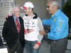 Toyota driver Ralf Schumacher of Germany gathers with Briatore and Watkins in Indianapolis.