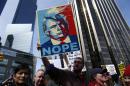 People rally as they take part in a protest against Republican presidential front-runner Donald Trump in New York on March 19, 2016