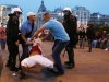Plainclothed police detain a Polish fan during the Euro 2012 soccer championship group a match between Poland and Russia in downtown Warsaw, Poland , Tuesday, June 12, 2012. (AP Photo/Czarek Sokolowski)