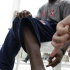 US sprinter Justin Gatlin points to a frostbite scar on his leg during an interview with the Associated Press in Daegu, South Korea, Wednesday, Aug. 24, 2011. The World Athletics Championships run Aug. 27 through Sept. 4, 2011 in Daegu. (AP Photo/David J. Phillip)