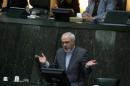 Iranian Foreign Minister Mohammad Javad Zarif addresses the parliament in Tehran on November 27, 2013, as MPs were reviewing the accord struck with world powers on the weekend over Iran's controversial nuclear programme