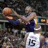Los Angeles Lakers guard Kobe Bryant is fouled by Sacramento Kings center DeMarcus Cousins as he drives to the basket during the second half of an NBA basketball game in Sacramento, Calif., Wednesday, Nov. 21, 2012. The Kings won 113-97. (AP Photo/Rich Pedroncelli)