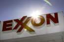 FILE - This Oct. 26, 2006, file photo shows an Exxon logo at a gas station in Dallas. Exxon Mobil said Thursday, April 26, 2012, that it earned $9.45 billion, or $2 per share, in the first quarter, down from $10.7 billion, or $2.14, a year earlier. Revenue rose 8.8 percent to $124.1 billion. (AP Photo/LM Otero, File)