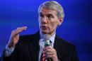 Senate Budget Committee member Sen. Rob Portman, R-Ohio, speaks at the 2014 Fiscal Summit organized by the Peter G. Peterson Foundation in Washington, Wednesday, May 14, 2014. Lawmakers and policy experts discussed America's long term debt and economic future. (AP Photo)