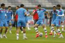 Iran's Karim Ansarifard, third from right, plays the ball during an official training session the day before the group F World Cup soccer match between Iran and Nigeria at the Arena da Baixada in Curitiba, Brazil, Sunday, June 15, 2014. (AP Photo/Frank Augstein)
