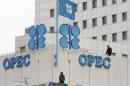 Police officers stand guard on the rooftop of Vienna's OPEC headquarters before the start of ...
