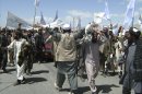 More than 1,500 Afghans block the highway between Kabul and Kandahar in Seed Abad, Wardak province, Afghanistan, Saturday, May 26, 2012. The protesters demanded a stop to military night operations. (AP Photo/Rahmatullah Nikzad)