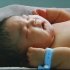 In this image made on Saturday, Feb. 4, 2012, from CCTV television,  a 15-pound baby named Chun Chun,  sleeps at Xinxiang Maternity Hospital, in Xinxiang city, Henan province, China.  A mother in central China gave birth to the 15.52 pound (7.04 kilogram) baby on Saturday, possibly the largest newborn on record since the country's founding in 1949. (AP Photo/CCTV via APTN) TV OUT, CHINA OUT