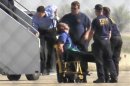 File photo of pilot Clayton Osbon being removed from a JetBlue passenger jet in Amarillo