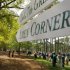 A sign points the way to the famed Amen Corner as patrons watch a practice round for the 2009 Masters golf tournament at the Augusta National Golf Club in Augusta
