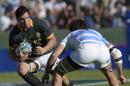 South Africa Springboks' flanker Francois Louw (L) challenges Argentina Los Pumas' flanker Juan Fernandez Lobbe during their Rugby Championship second round match at Padre Ernesto Martearena stadium in Salta on August 23, 2014