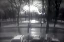 This frame grab provided by Rostov-on-Don I General company from black and white CCTV footage shows road and behind line of trees fireball, believed to be a plane on fire, crashes to ground at the Rostov-on-Don airport, about 950 kilometers (600 miles) south of Moscow, Russia Saturday, March 19, 2016. An airliner coming from Dubai crashed early Saturday while landing in the southern Russian city of Rostov-on-Don, Russia's Emergencies Ministry said. (Rostov-on-Don I General company via AP)