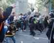 People tussled with police following Game 7 of the NHL hockey Stanley Cup Finals between the Vancouver Canucks and the Boston Bruins on Wednesday, June 15, 2011, in Vancouver, British Columbia. (AP Ph