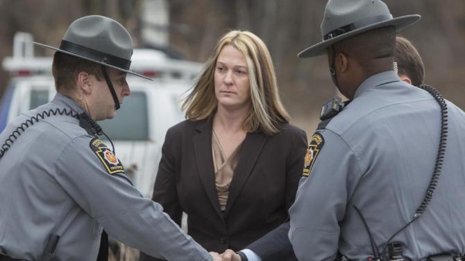 Hummelstown, Pa., Police officer Lisa Mearkle walks into District Judge Lowell A. Witmer&#39;s office in West Hanover Twp., Tuesday, March 24, 2015, for her preliminary arraignment in connection with the shooting death of David Kassick during a traffic stop in February 2015. She was charged with criminal homicide, and is being held without bail over the Feb. 2 shooting. Investigators say Mearkle had incapacitated Kassick with a stun gun and he was on the ground when she shot him twice. She told investigators she thought he was reaching into his jacket for a gun.(AP Photo/PennLive.com, Mark Pynes)