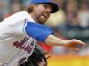 New York Mets starter R.A. Dickey throws a pitch against the Philadelphia Phillies in the second inning of the first baseball game of a doubleheader in New York, Saturday, Sept. 24, 2011. (AP Photo/Paul J. Bereswill)