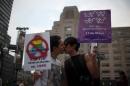Activists kiss during an event for International Day against homophobia, in Mexico City on May 17, 2016