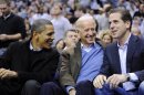 FILE - This Jan. 30, 2010 file photo shows Hunter Biden, right, son of Vice President Joe Biden, center, talking with President Barack Obama, and the vice president Joe Biden during a college basketball game in Washington. Biden's youngest son Hunter is joining the Navy. The Navy says the attorney and former Washington lobbyist was selected to be commissioned into the Navy Reserve as a public affairs officer. Because he is 42, he needed a special waiver to be accepted, but that is not uncommon. He is one of seven candidates recommended for a direct commission for public affairs. (AP Photo/Nick Wass, File)