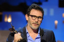 Michel Hazanavicius accept the best director award for The Artist at the Independent Spirit Awards on Saturday, Feb. 25, 2012, in Santa Monica, Calif. (AP Photo/Vince Bucci)