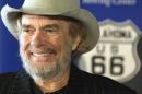 FILE - In this May 28, 2003 file photo, country music legend Merle Haggard smiles during a news conference at the Smithsonian's National Museum of American History in Washington where he and his sister Lillian Haggard Hoge donated belongings taken on their family's Dust Bowl-era move from Oklahoma to California on Route 66. Haggard died of pneumonia, Wednesday, April 6, 2016, in Palo Cedro, Calif. He was 79. (AP Photo/Rick Bowmer, File)
