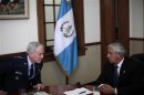 Fraser, Chief of the U.S. Southern Command, and Guatemalan President Perez Molina attend a meeting in Guatemala City