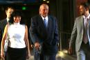 Former Minnesota Gov. Jesse Ventura, center, arrives at court with his wife, Terry, and others, Tuesday, July 22, 2014 in St. Paul, Minn. Closing arguments are set for Tuesday in Ventura's defamation lawsuit against the estate of "American Sniper" author Chris Kyle. (AP Photo/The Star Tribune, Jim Gehrz) MANDATORY CREDIT; ST. PAUL PIONEER PRESS OUT; MAGS OUT; TWIN CITIES LOCAL TELEVISION OUT