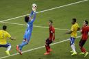 Mexico's goalkeeper Guillermo Ochoa makes a save during the group A World Cup soccer match between Brazil and Mexico at the Arena Castelao in Fortaleza, Brazil, Tuesday, June 17, 2014. (AP Photo/Themba Hadebe)
