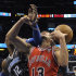 Chicago Bulls center Joakim Noah (13) is fouled by Orlando Magic center Dwight Howard while going up for a shot during the first half of an NBA basketball game in Orlando, Fla., Monday, March 19, 2012. (AP Photo/Phelan M. Ebenhack)