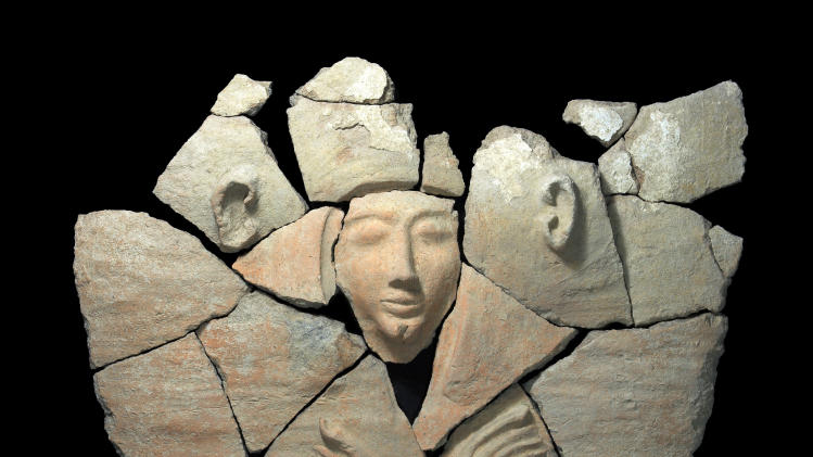 This undated photo released by Israel’s Antiquities Authority shows a sarcophagus found at Tel Shadud, an archaeological mound in the Jezreel Valley. Israeli archaeologists have unearthed a rare sarcophagus featuring a slender face and a scarab ring inscribed with the name of an Egyptian pharaoh, Israel’s Antiquities Authority said Wednesday April 9, 2014. (AP Photo/ Israel’s Antiquities Authority)