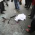 EDS NOTE: GRAPHIC CONTENT - In this photo provided by the semi-official Fars News Agency, people gather around shattered glass and human remains in Tehran, Iran, Wednesday, Jan. 11, 2012. Two assailants on a motorcycle attached magnetic bombs to the car of an Iranian university professor working at a key nuclear facility, killing him and wounding two people on Wednesday, a semiofficial news agency reported. (AP Photo/Fars News Agency, Mehdi Marizad)