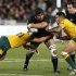 Victor Vito of New Zealand's All Blacks is tackled by Anthony Fainga'a and Digby Ioane of Australia's Wallabies' in their Bledisloe Cup rugby union test match in Auckland