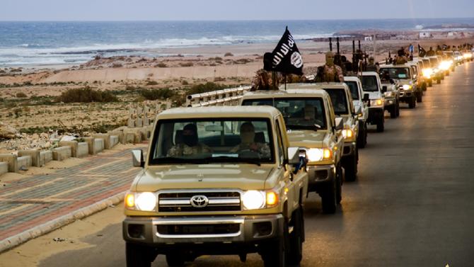 An image from Islamist media outlet Welayat Tarablos on February 18, 2015 allegedly shows members of the Islamic State group parading in a street in Libya's coastal city of Sirte