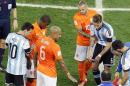 Argentina's Javier Mascherano lies on the ground after clashing head to head with a dutch player during the World Cup semifinal soccer match between the Netherlands and Argentina at the Itaquerao Stadium in Sao Paulo Brazil, Wednesday, July 9, 2014. (AP Photo/Hassan Ammar)