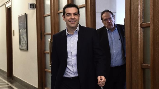Greek Prime Minister Alexis Tsipras arrives for a ministerial meeting at the parliament in Athens on February 24, 2015